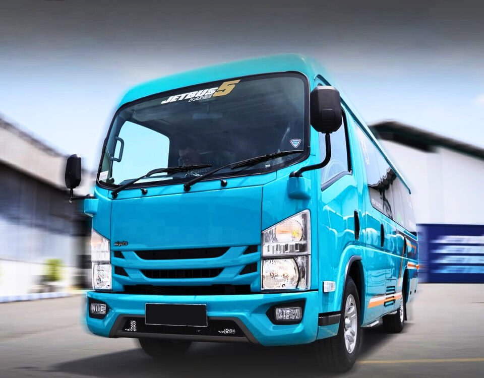 Blue delivery van driving toward the camera with DYAN TRANSPORT logo in the top-left.