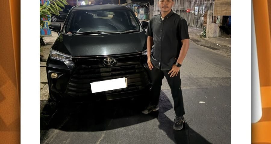 WhatsApp Image 2026-06-10 at 08.47.28 - Dyantransport Man in a black shirt posing beside a black SUV on a nighttime city street and storefronts in the background, group photo-style post context included.