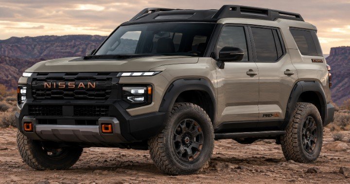 Nissan Frontier Pro-4X SUV in tan on a rocky desert trail at sunset, ready for off-roading.