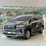 WhatsApp Image 2026-08-09 at 105239 - Dyantransport Gray Toyota SUV on a glossy showroom floor with glass walls and other cars in the background (front three-quarter view).